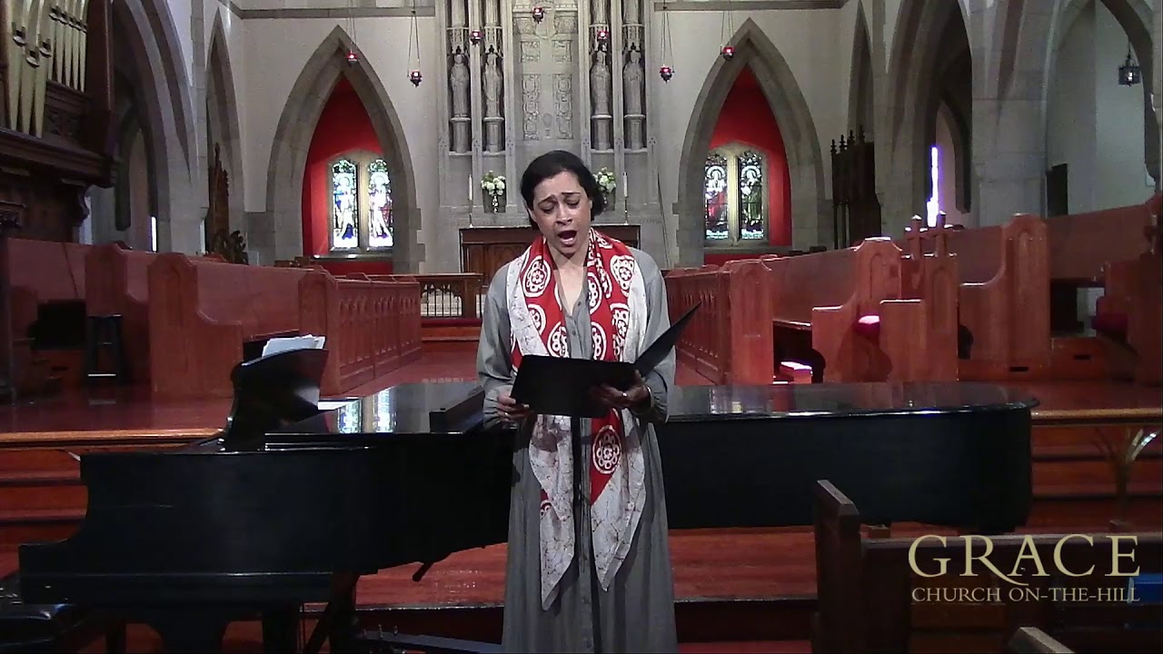 Karen Usha Gray singing in a church